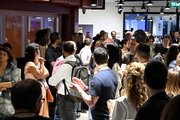 Attendees of the EvolveDigital conference gather in the Montreal Cowork office, on August 4, 2025.
