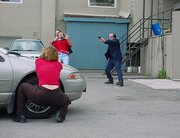 standoff as Louis is held hostage in the film "Lucky - or Not?"