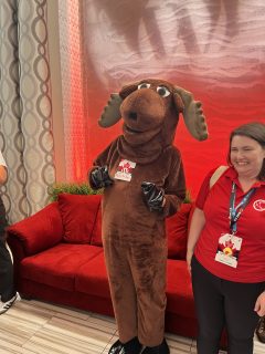 Morty the Moose, the official mascot for the Canadian Internet Registration Authority and .ca domains, poses for photos in the lobby of the conference center at WordCamp Canada 2024